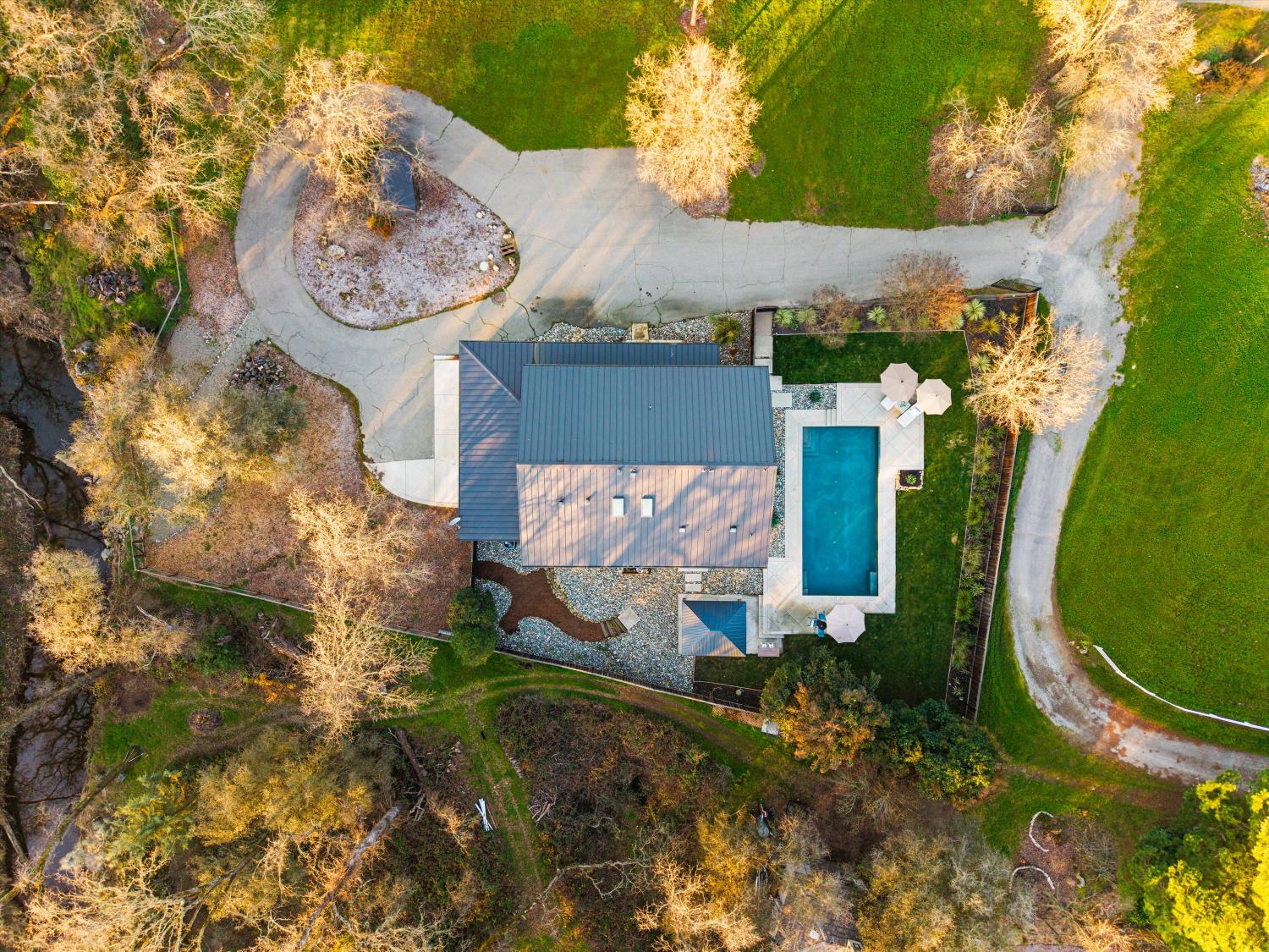 6620 Auburn Folsom Road Granite Bay, CA 95746 - Photo 3 of 69 an aerial view of a house with garden space and a lake view
