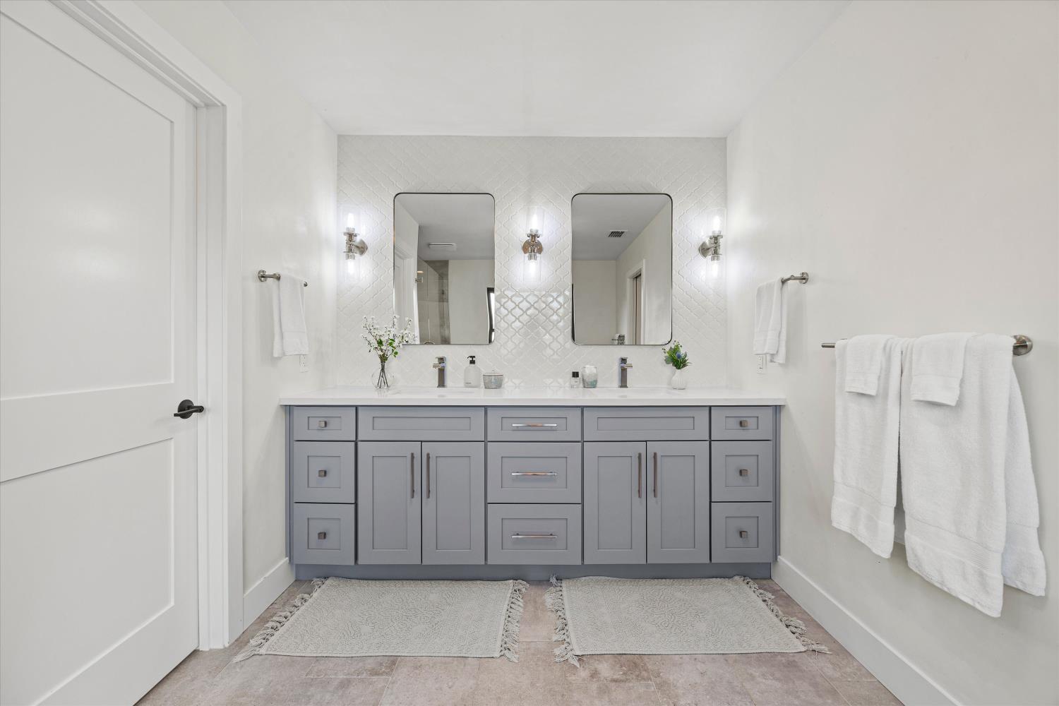 6620 Auburn Folsom Road Granite Bay, CA 95746 - Photo 32 of 69 a spacious bathroom with a double vanity sink a mirror and a bathtub