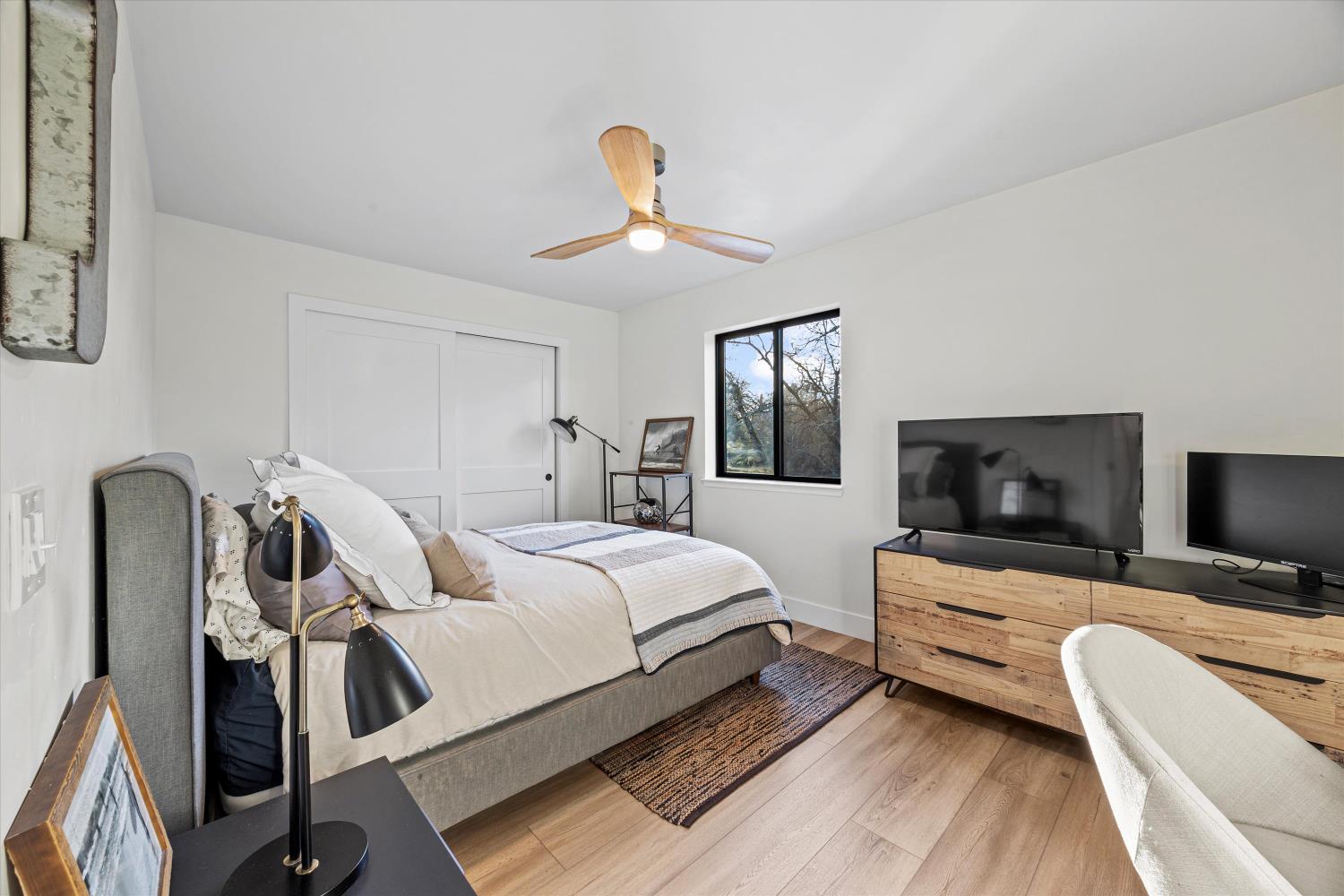 6620 Auburn Folsom Road Granite Bay, CA 95746 - Photo 36 of 69 a bedroom with a bed couch and a flat tv screen