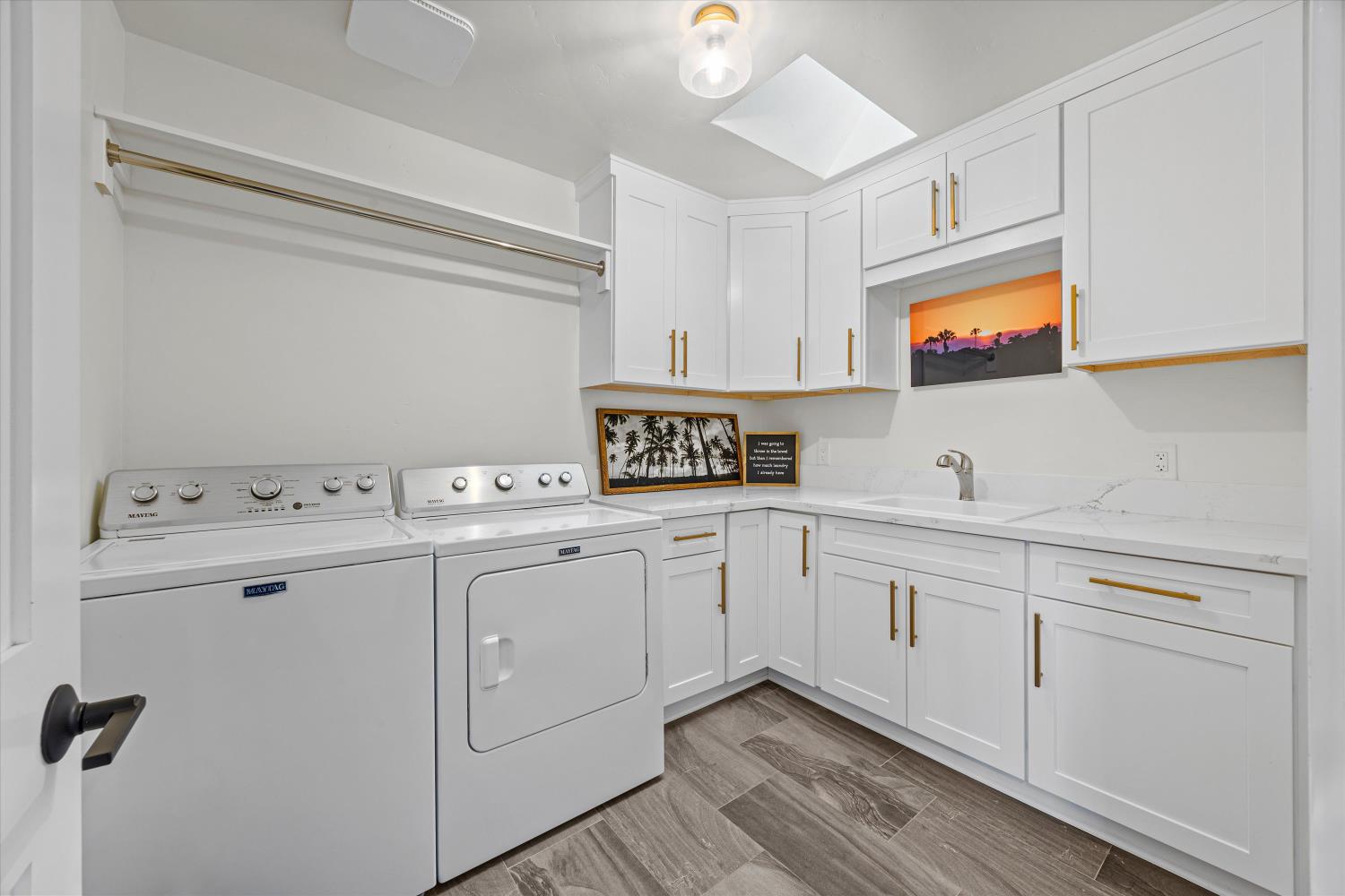 6620 Auburn Folsom Road Granite Bay, CA 95746 - Photo 40 of 69 a kitchen with a sink cabinets and wooden floor