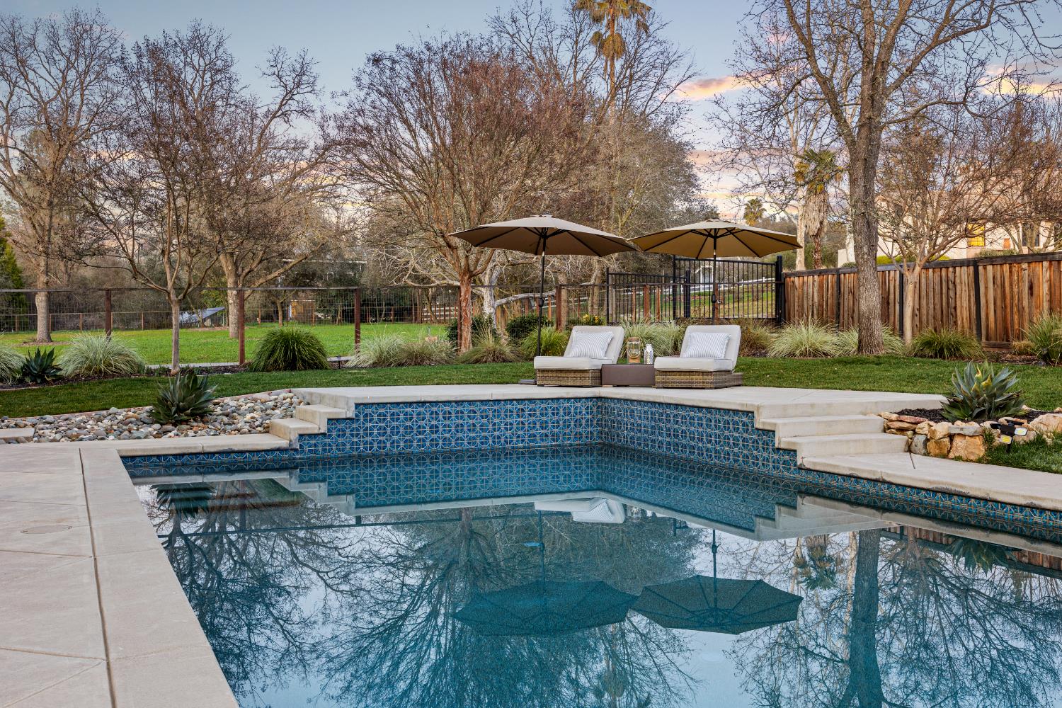 6620 Auburn Folsom Road Granite Bay, CA 95746 - Photo 42 of 69 a view of a swimming pool with a patio and a garden