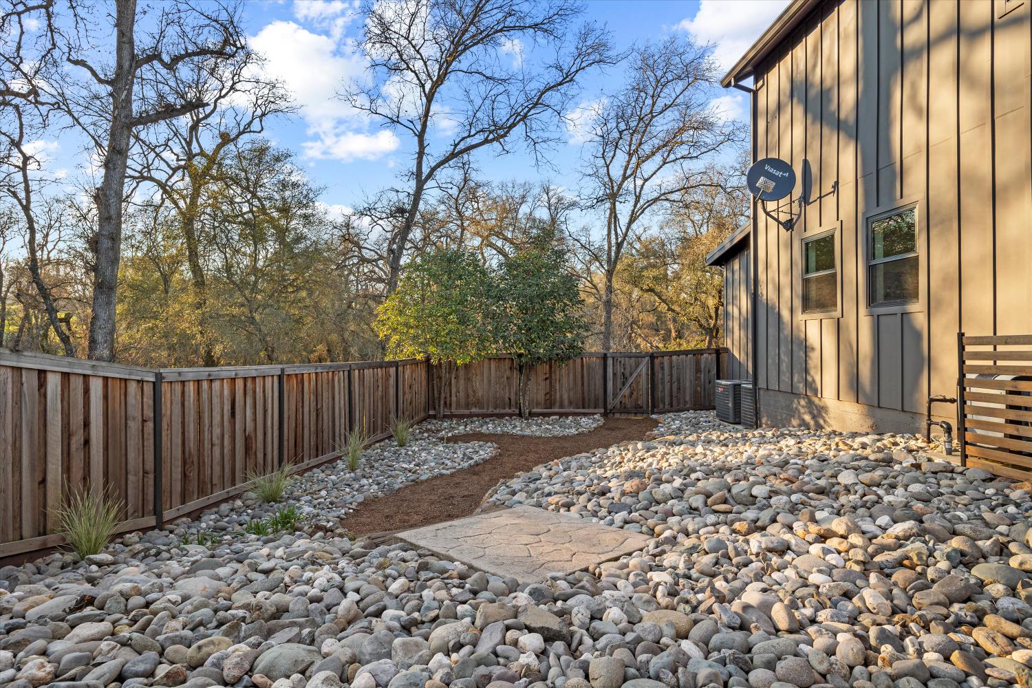 6620 Auburn Folsom Road Granite Bay, CA 95746 - Photo 51 of 69 a view of a backyard with wooden fence and large trees
