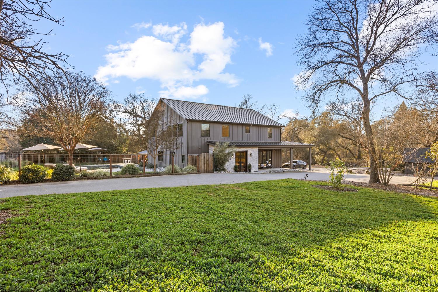 6620 Auburn Folsom Road Granite Bay, CA 95746 - Photo 60 of 69 a view of a house with a big yard and large trees