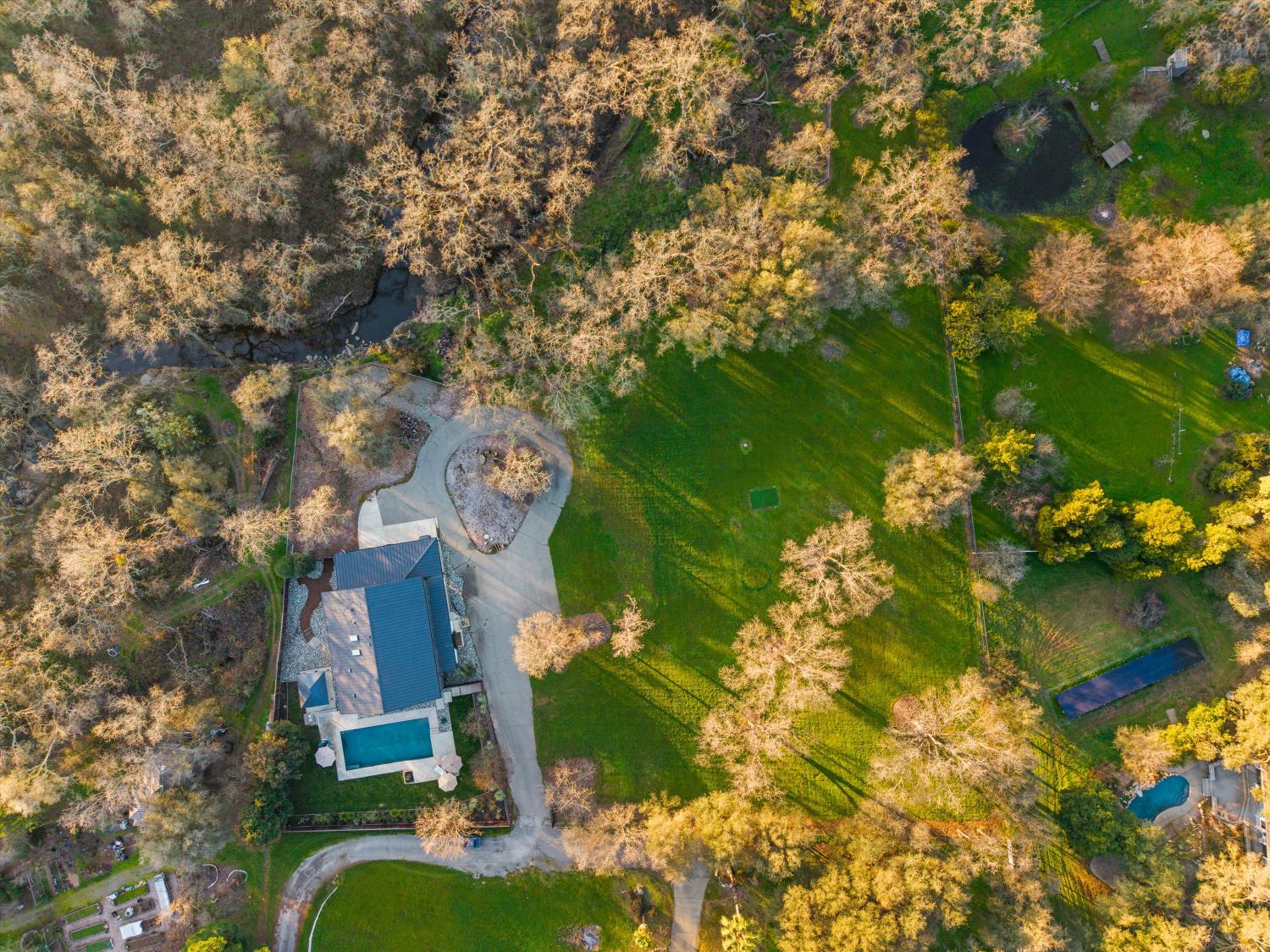6620 Auburn Folsom Road Granite Bay, CA 95746 - Photo 66 of 69 a backyard of a house with a garden and outdoor seating