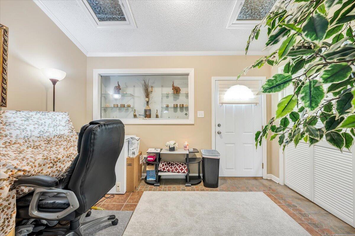 2247 Ranch Road Northwest Roanoke, VA 24017 - Photo 3 of 32 a workspace with furniture and a potted plant