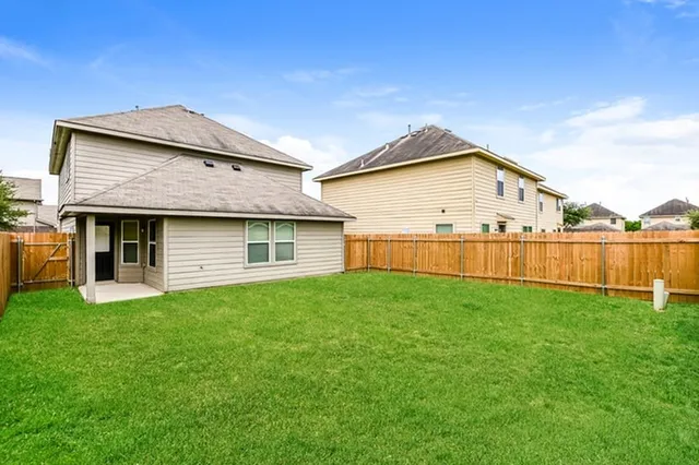 a view of front of house with a yard
