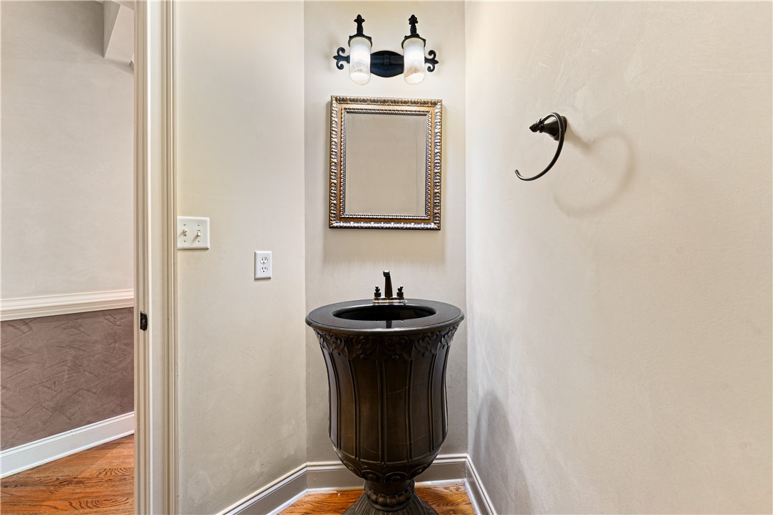 109 Limelight Drive Anderson, SC 29621 - Photo 16 of 34 This elegantly appointed bathroom features a pedestal sink and hardwood floors.