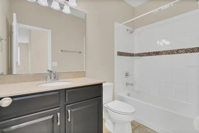 a bathroom with a sink a toilet and a bathtub