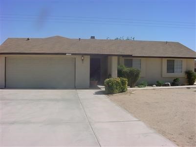 11555 Mohawk Road Apple Valley, CA 92308 - Photo 1 of 1 front view of a house with a yard