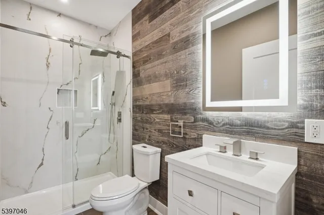 an empty room with wooden floor and door