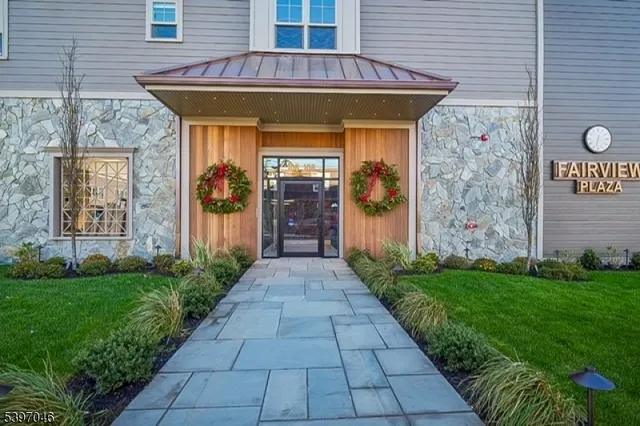 a kitchen with a refrigerator a sink and cabinets