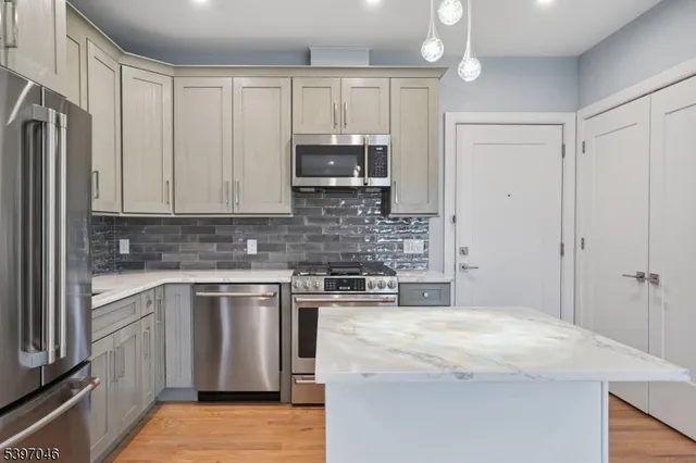 a kitchen with a stove and a microwave