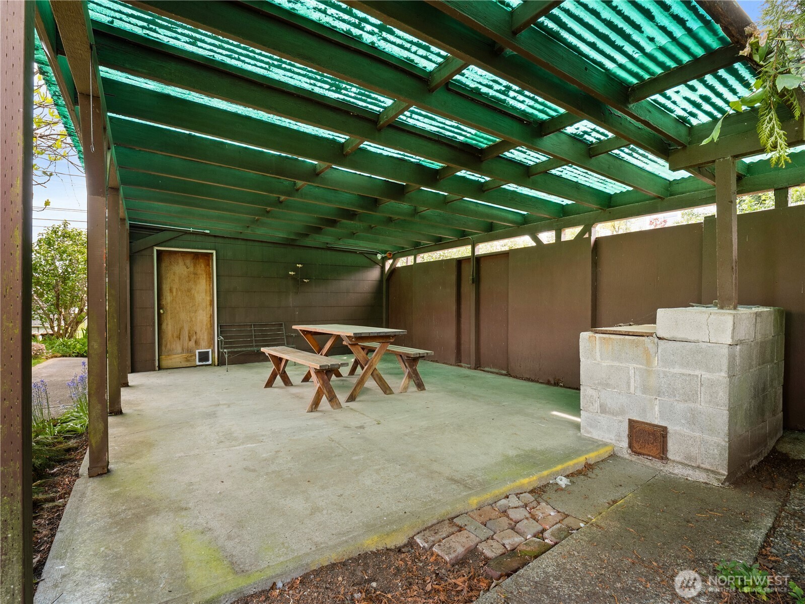 5704 North Ruby Street Tacoma, WA 98407 - Photo 32 of 38 a view of a backyard with a patio and a table