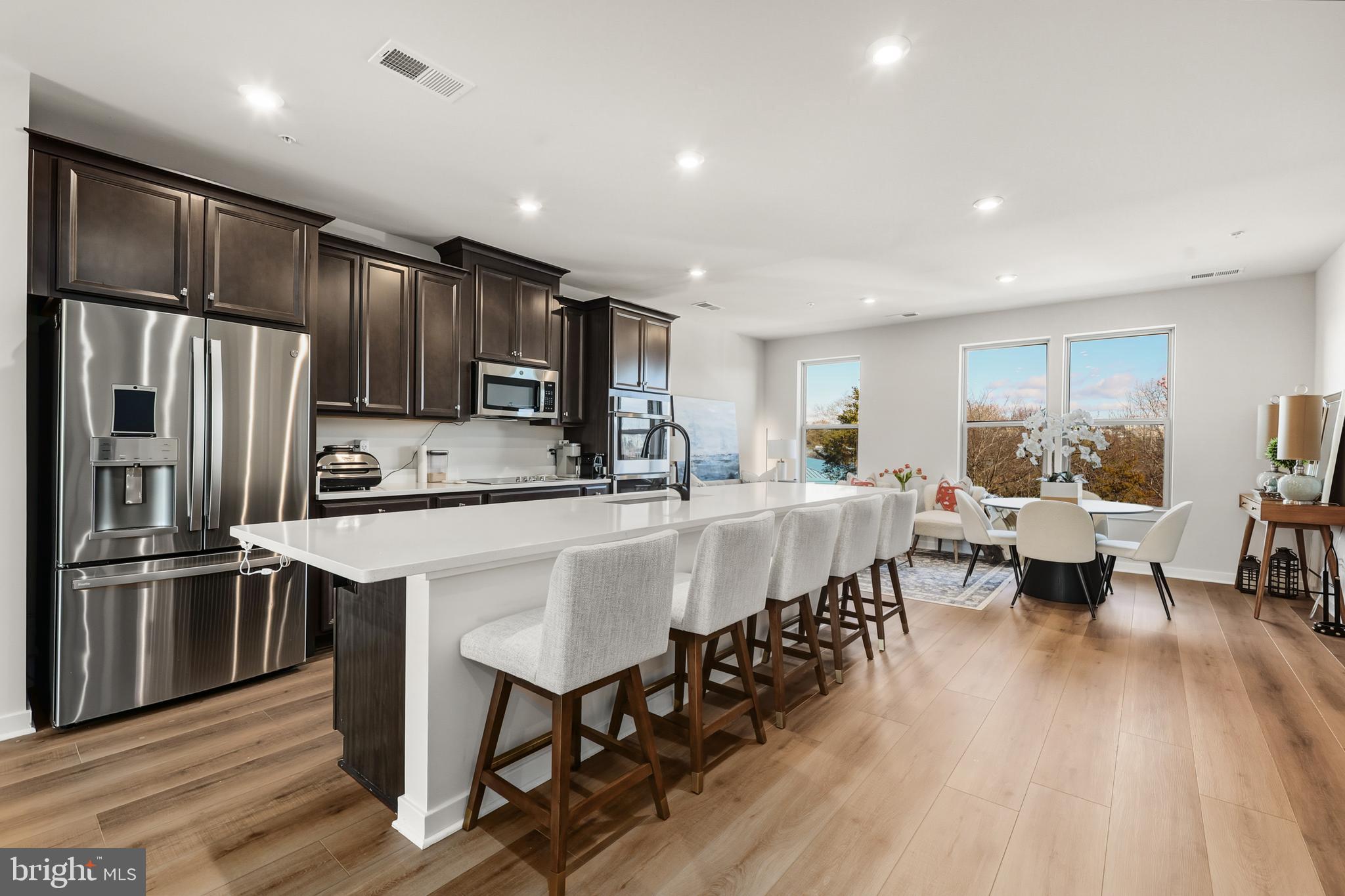 13508 INNOVATION Sta Loop Herndon, VA 20171 - Photo 10 of 29 a large kitchen with lots of counter space a sink appliances and dining table