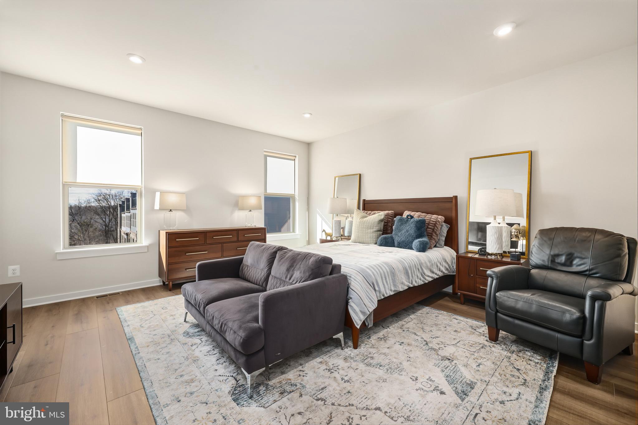 13508 INNOVATION Sta Loop Herndon, VA 20171 - Photo 16 of 29 a bedroom with a bed couch and wooden floor