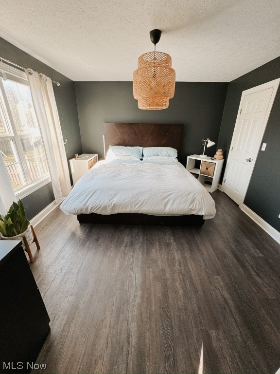 3249 Rausch Avenue Ravenna, OH 44266 - Photo 15 of 35 Bedroom with dark hardwood / wood-style flooring and a textured ceiling