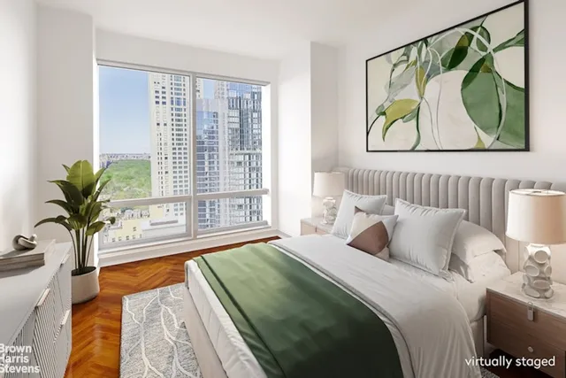 a bedroom with a bed and a view of kitchen