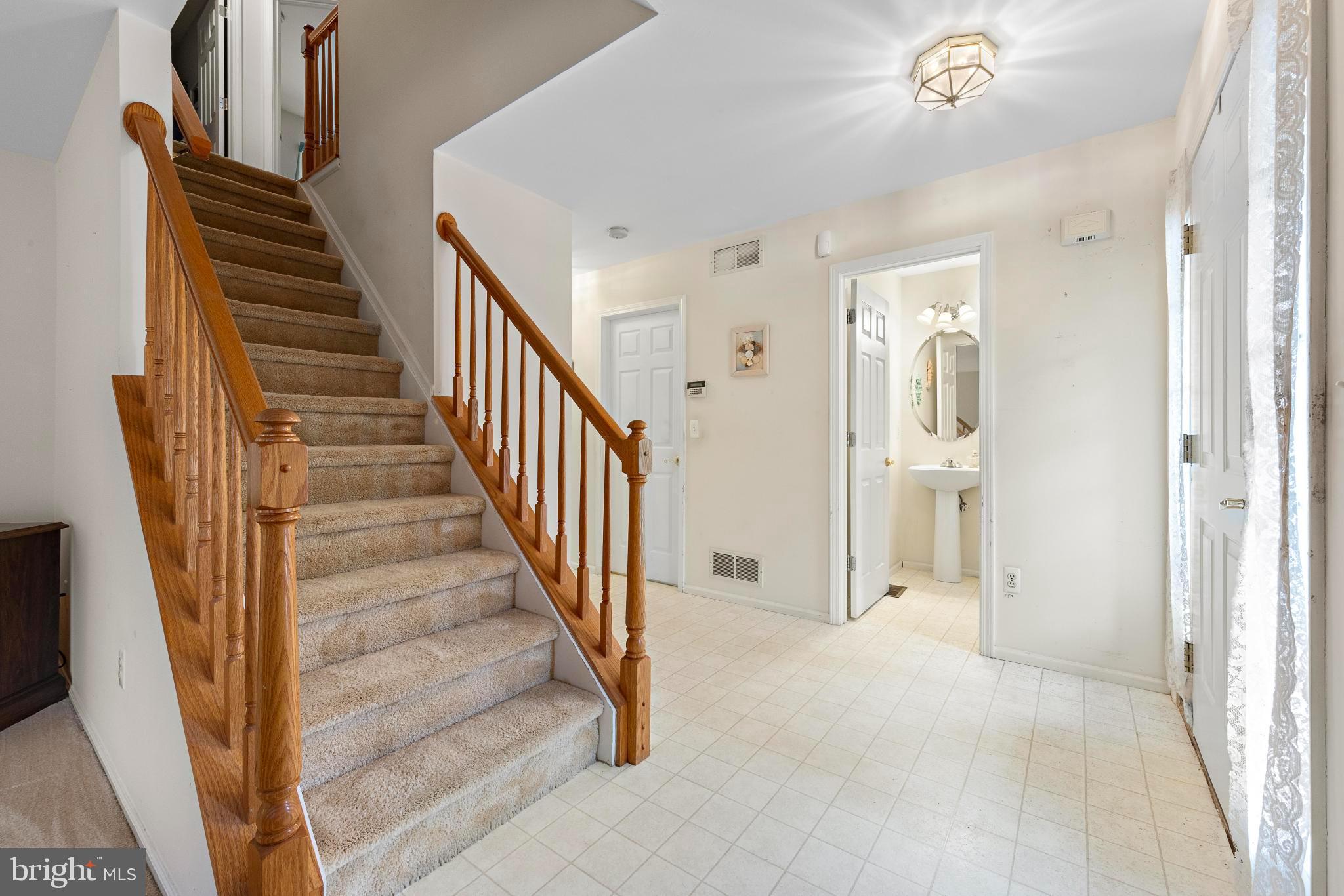 249 Topside Road Manahawkin, NJ 08050 - Photo 25 of 49 a view of a hallway with wooden floor and entryway