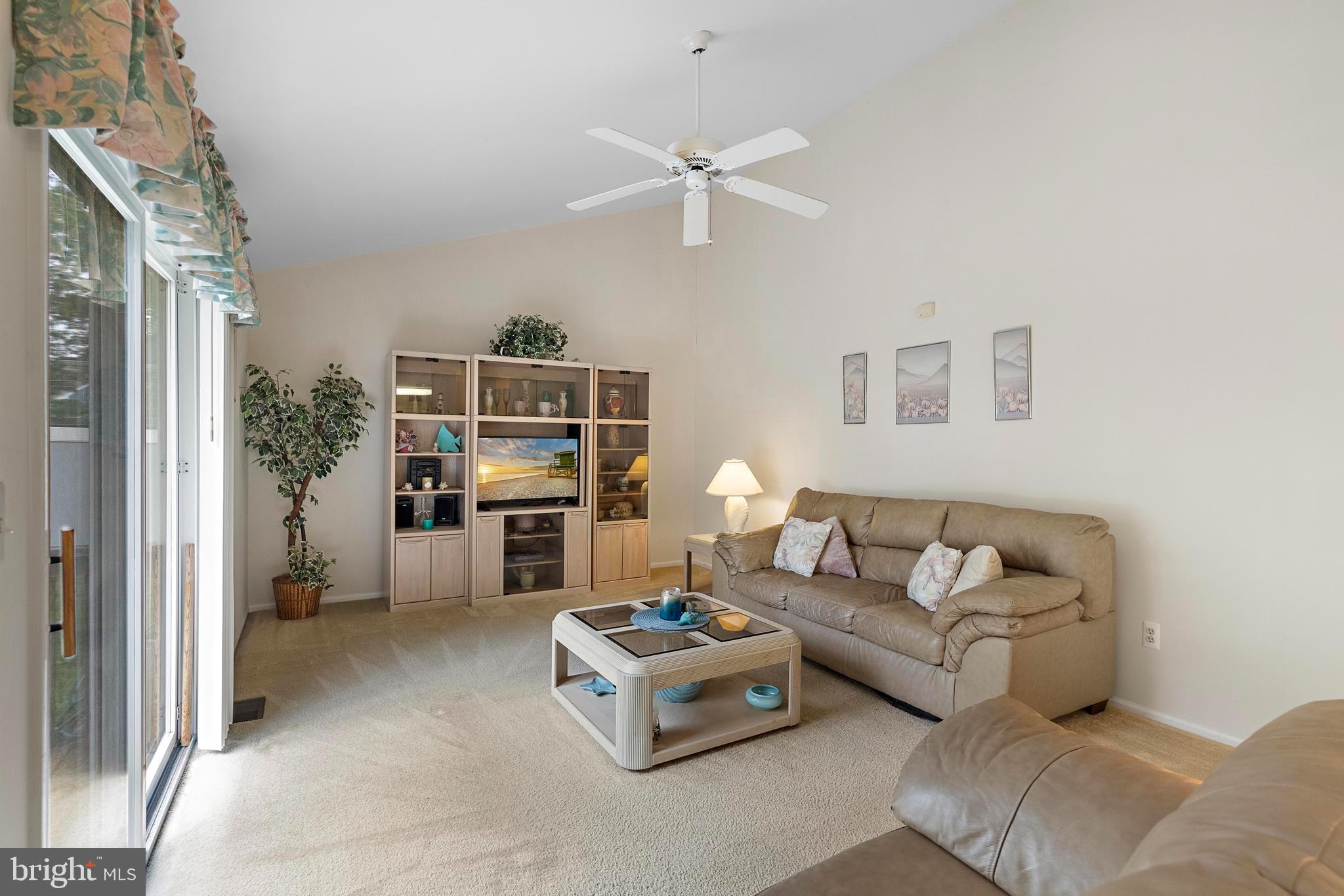 249 Topside Road Manahawkin, NJ 08050 - Photo 27 of 49 a living room with furniture and a flat screen tv
