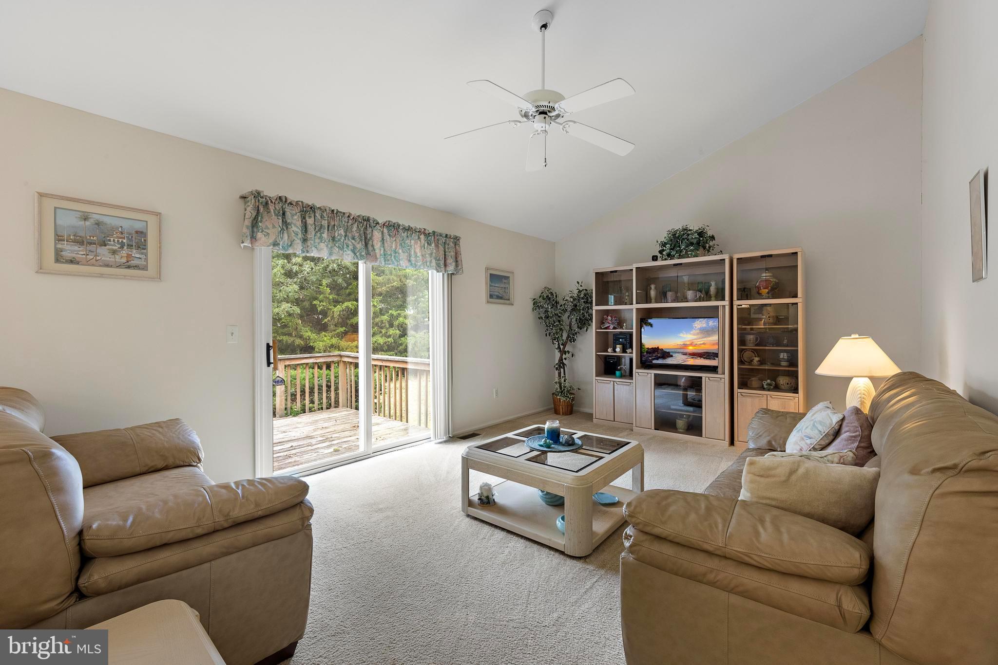 249 Topside Road Manahawkin, NJ 08050 - Photo 28 of 49 a living room with furniture and a flat screen tv