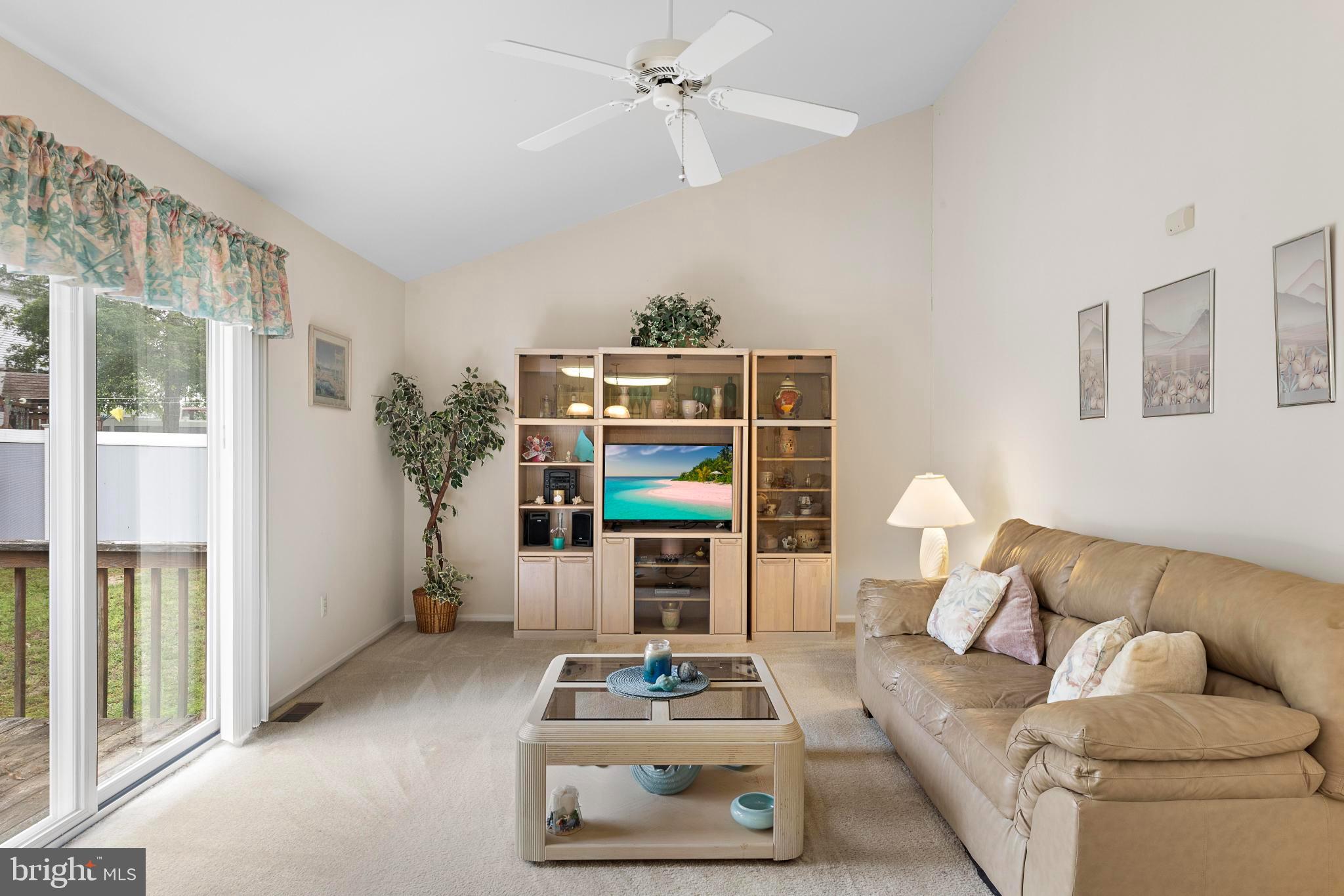249 Topside Road Manahawkin, NJ 08050 - Photo 29 of 49 a living room with furniture and a fireplace