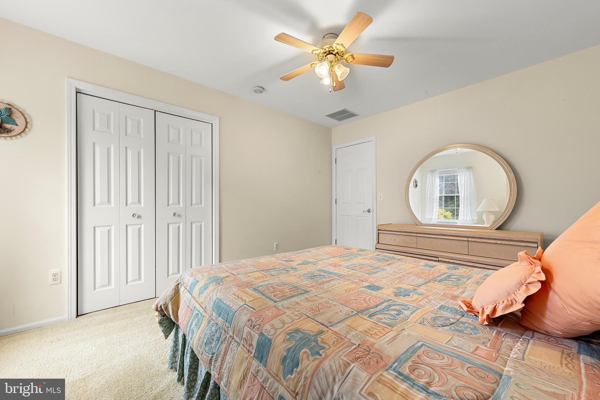 249 Topside Road Manahawkin, NJ 08050 - Photo 34 of 49 a bedroom with a bed and a window