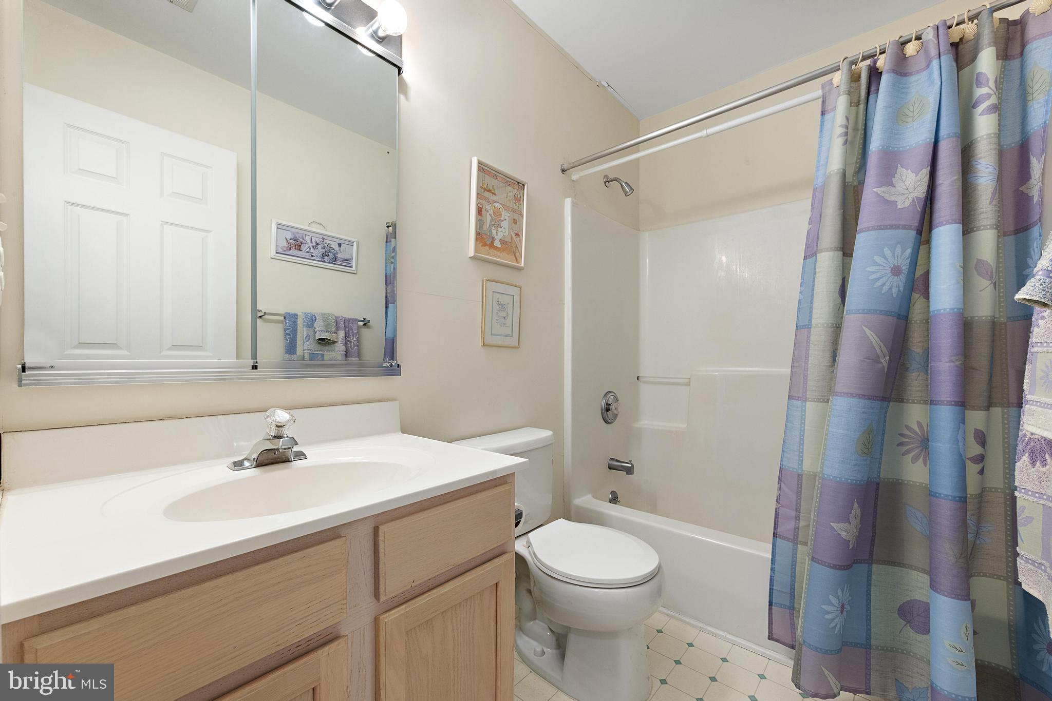 249 Topside Road Manahawkin, NJ 08050 - Photo 44 of 49 a bathroom with a sink toilet and shower
