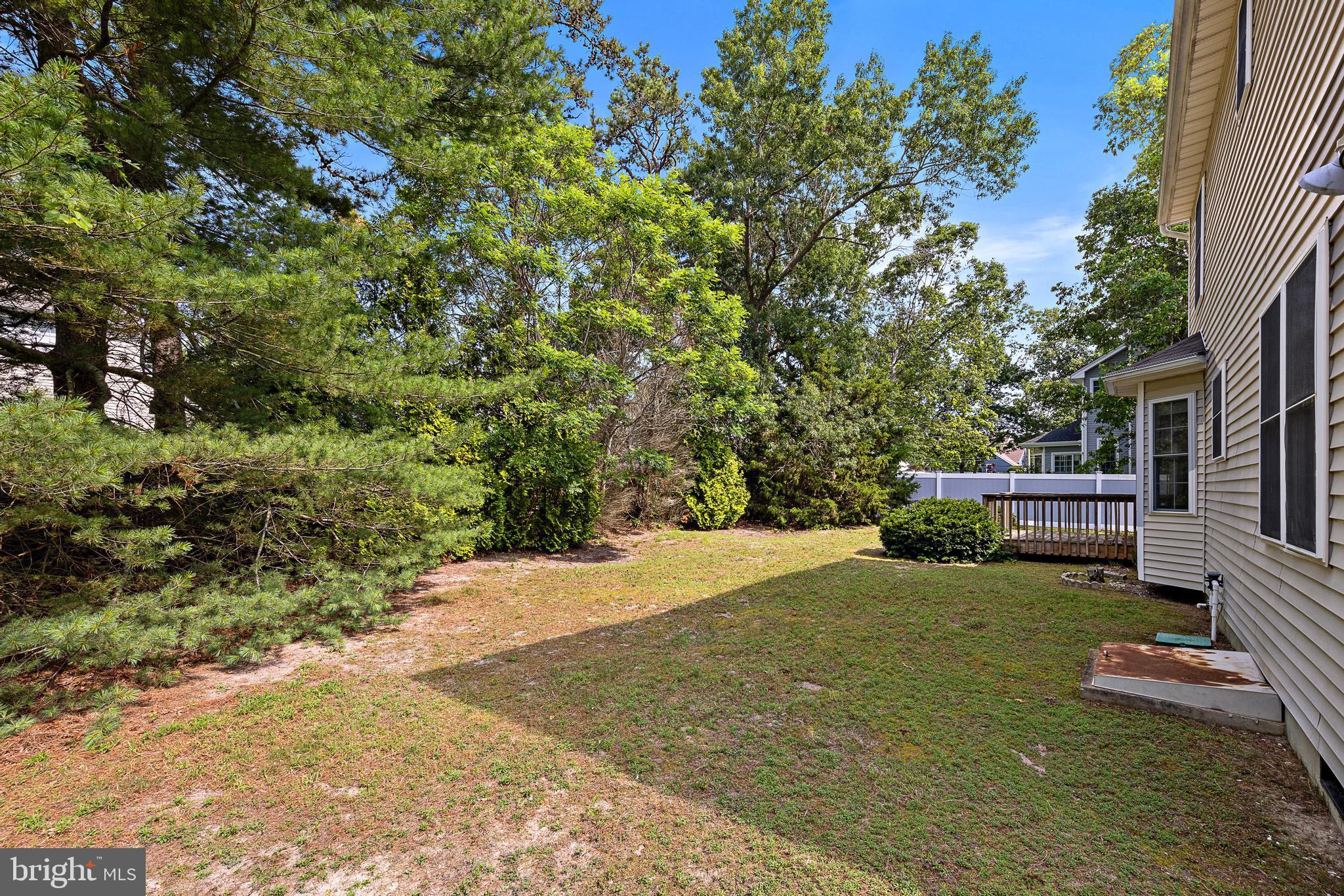 249 Topside Road Manahawkin, NJ 08050 - Photo 45 of 49 a view of a house with a yard