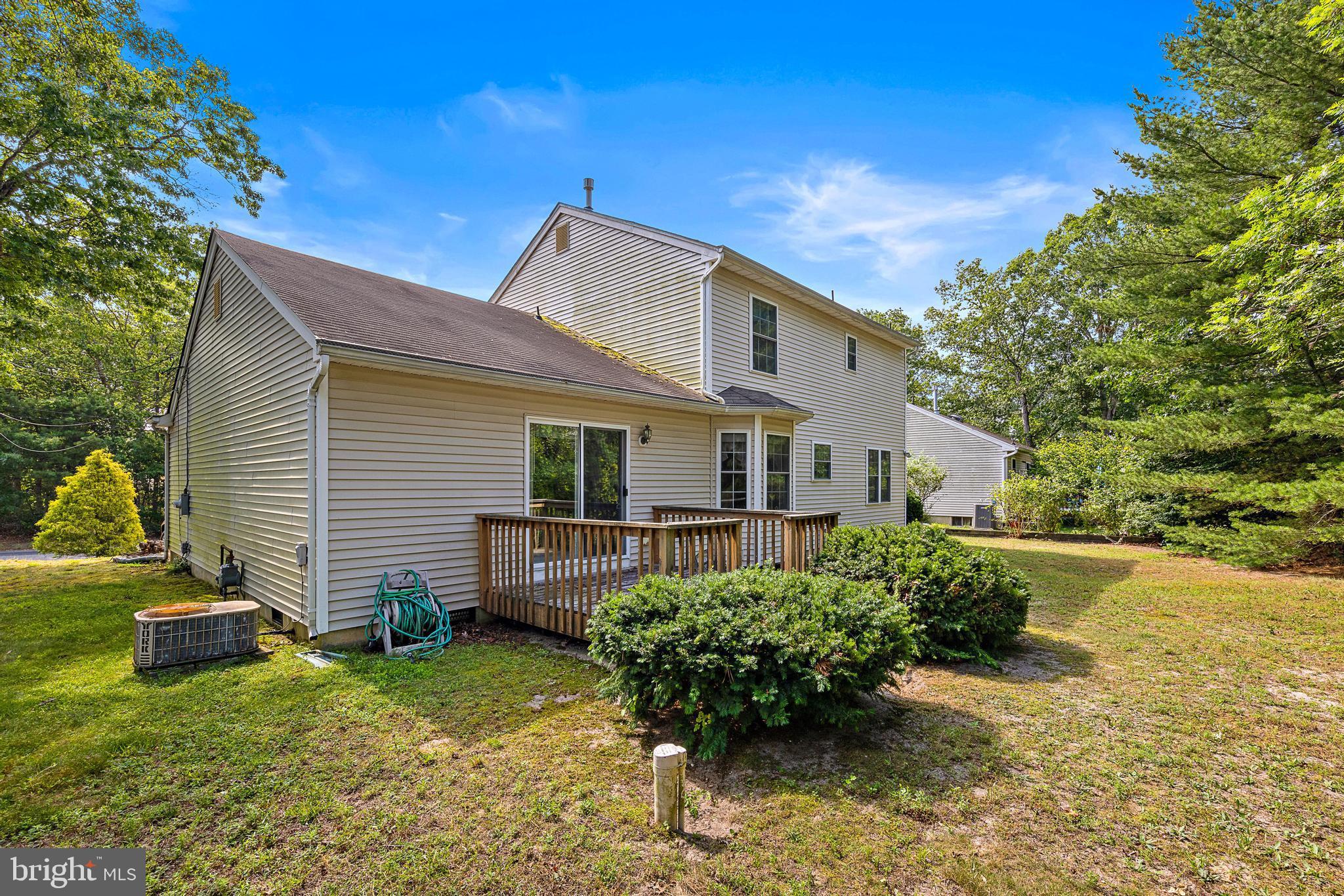 249 Topside Road Manahawkin, NJ 08050 - Photo 48 of 49 a view of a house with backyard and garden