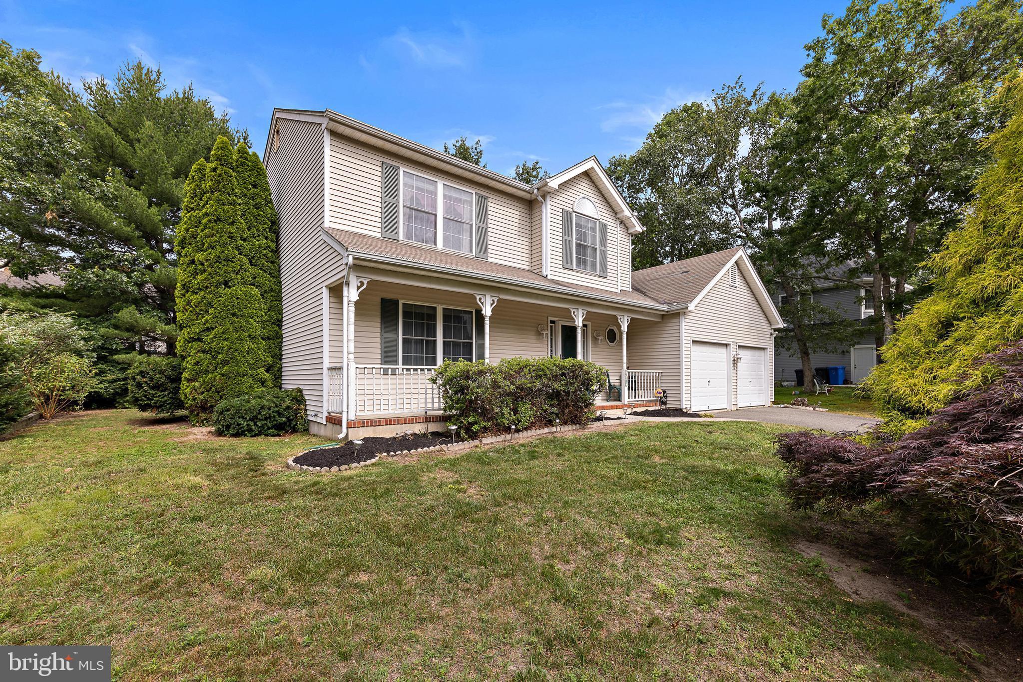 249 Topside Road Manahawkin, NJ 08050 - Photo 5 of 49 a front view of a house with a yard
