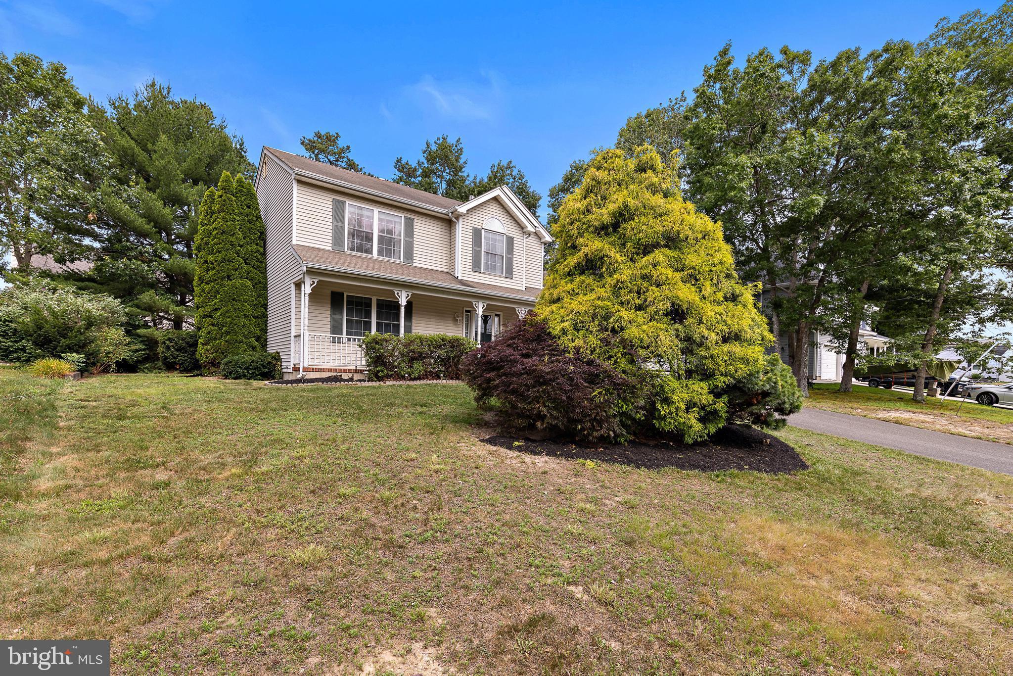 249 Topside Road Manahawkin, NJ 08050 - Photo 6 of 49 a view of a house with a garden