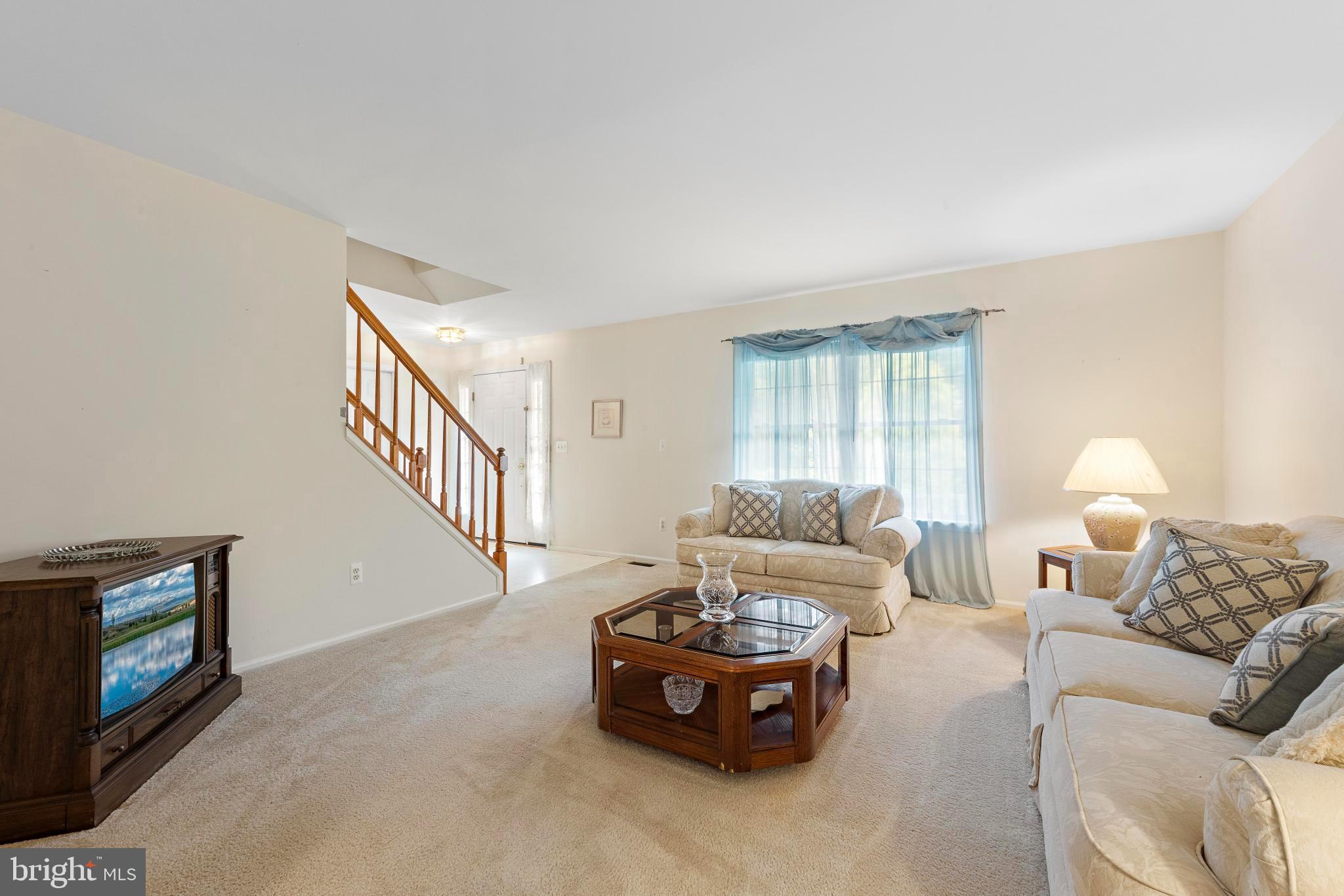 249 Topside Road Manahawkin, NJ 08050 - Photo 8 of 49 a living room with furniture and a fireplace