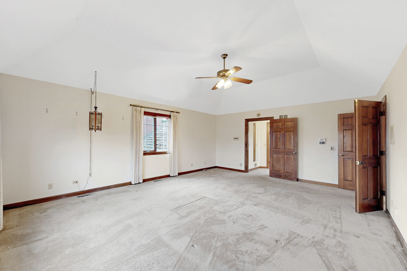 8282 Lake Ridge Drive Burr Ridge, IL 60527 - Photo 18 of 37 an empty room with closet and windows