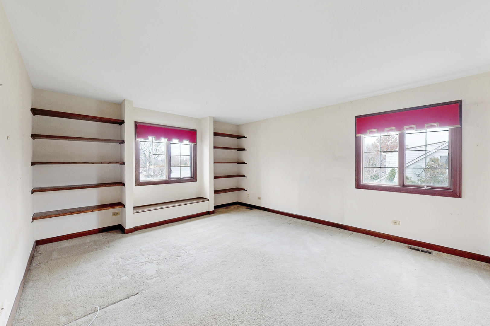 8282 Lake Ridge Drive Burr Ridge, IL 60527 - Photo 21 of 37 an empty room with windows and ceiling fan