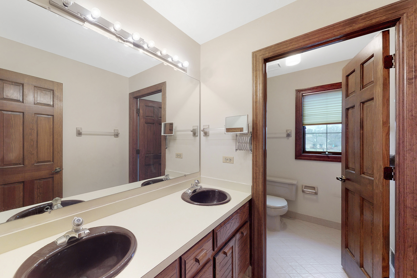 8282 Lake Ridge Drive Burr Ridge, IL 60527 - Photo 27 of 37 a bathroom with a sink a toilet and shower