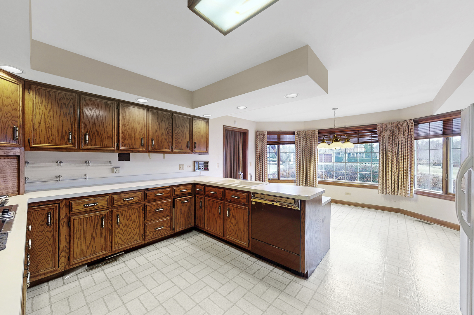 8282 Lake Ridge Drive Burr Ridge, IL 60527 - Photo 6 of 37 a large kitchen with stainless steel appliances granite countertop a sink and cabinets