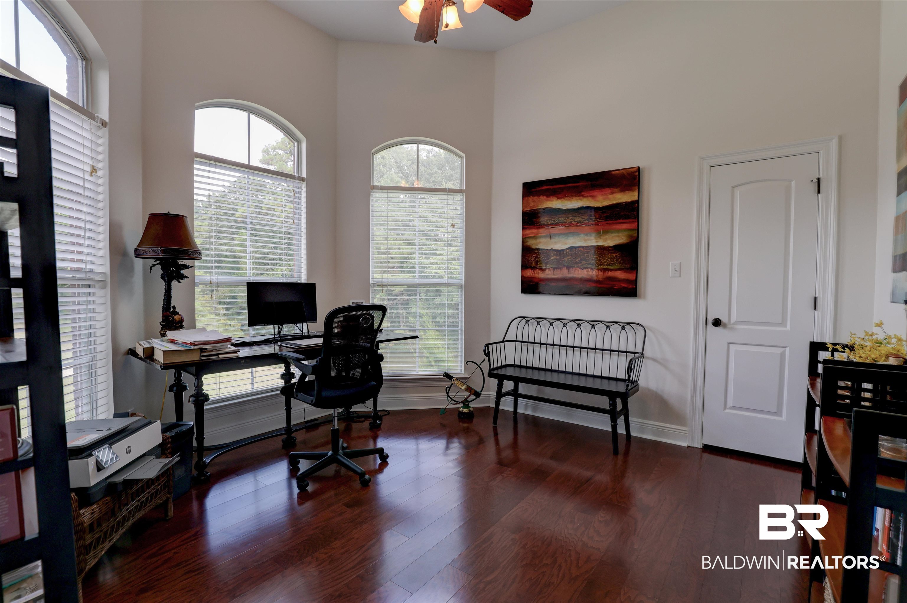 5565 Dawes Lane Theodore, AL 36582 - Photo 14 of 38 Home office featuring a wealth of natural light, a high ceiling, ceiling fan, and dark hardwood / wood-style floors