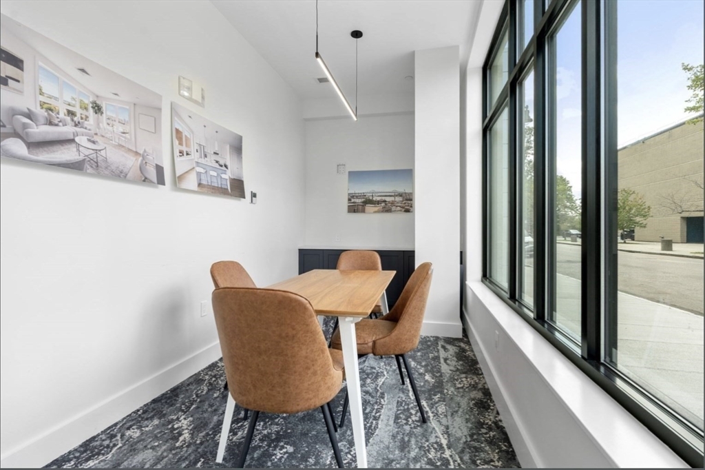 301 Border Street, Unit 610 Boston, MA 02128 - Photo 14 of 17 a view of a dining room with furniture window and outside view