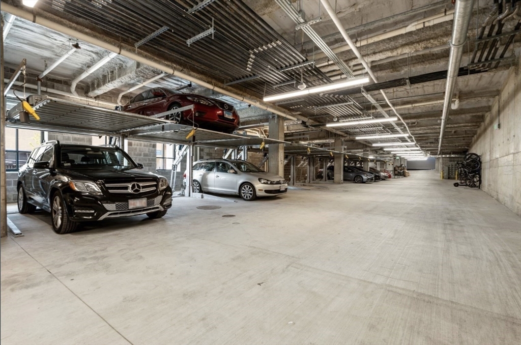 301 Border Street, Unit 610 Boston, MA 02128 - Photo 15 of 17 a view of parking garage with cars