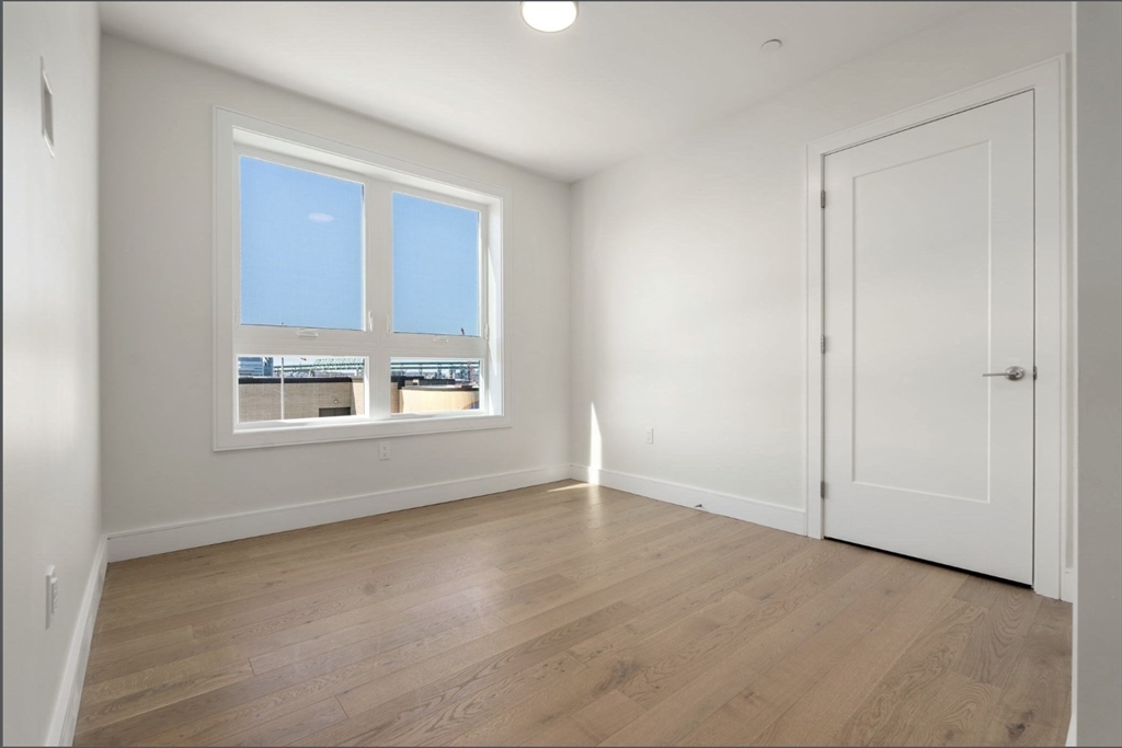 301 Border Street, Unit 610 Boston, MA 02128 - Photo 3 of 17 an empty room with a window