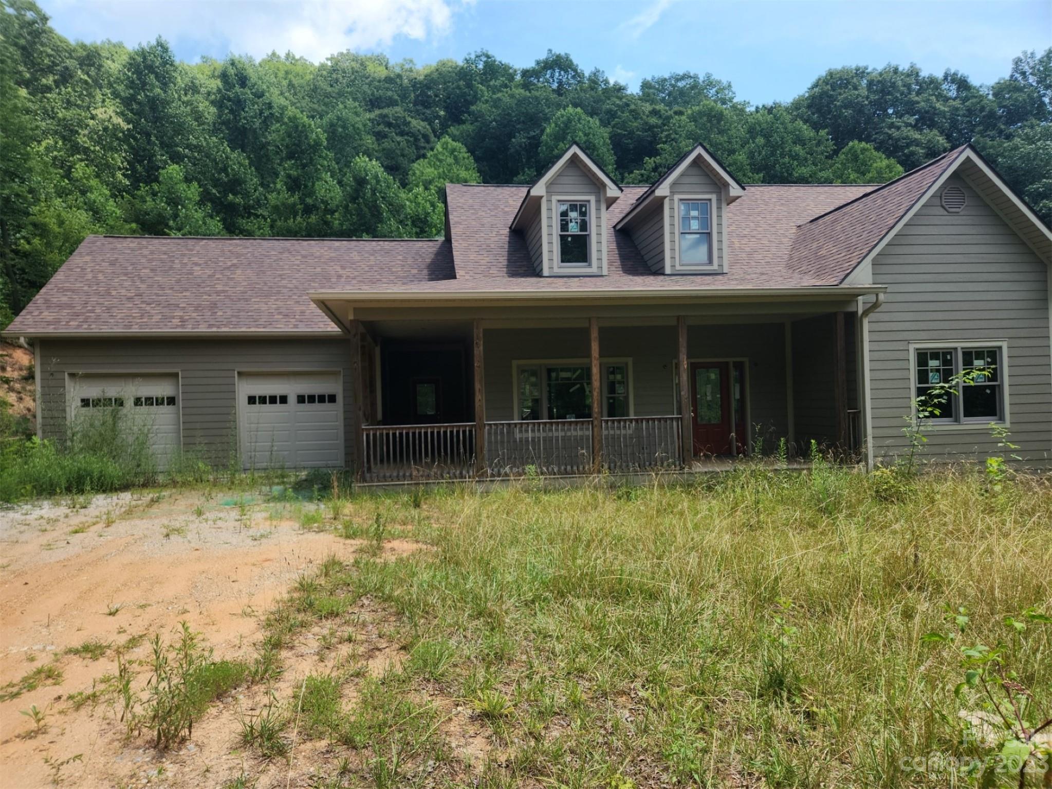 a view of a house with a yard