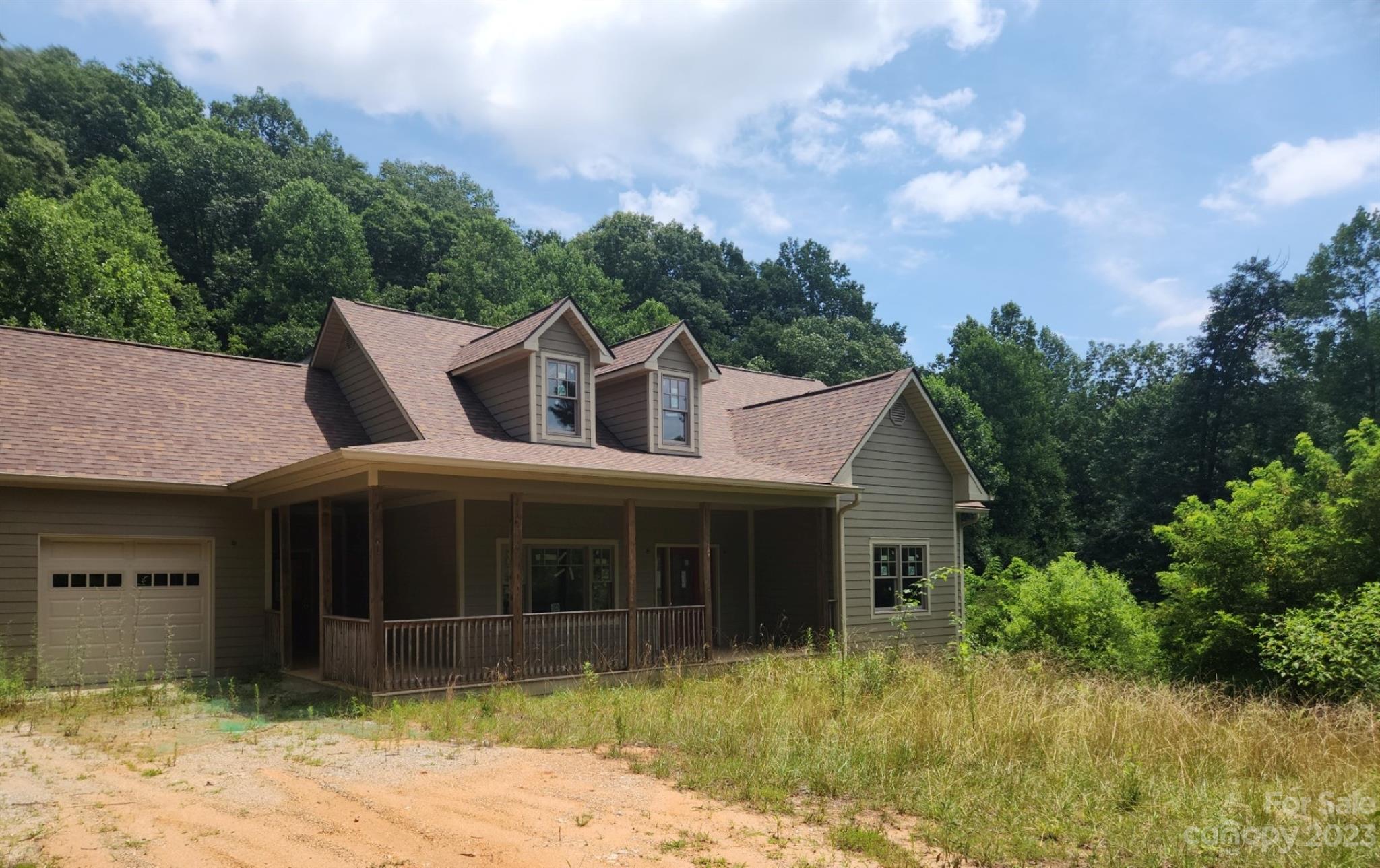 134 Lake George Road, Unit 969 & 970 Old Fort, NC 28762 - Photo 2 of 28 a front view of a house with a garden and yard