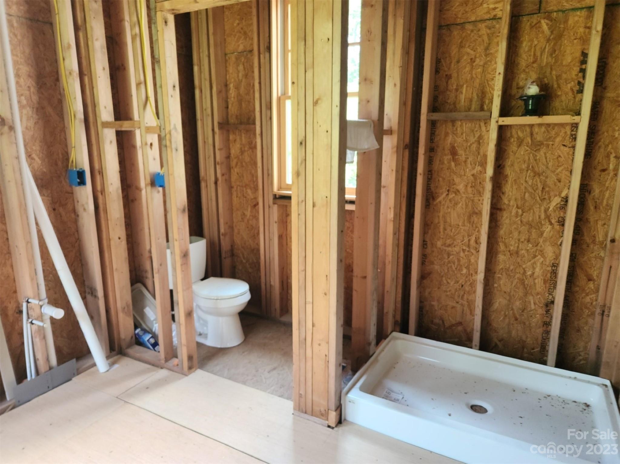 134 Lake George Road, Unit 969 & 970 Old Fort, NC 28762 - Photo 22 of 28 a bathroom with a tub and shower