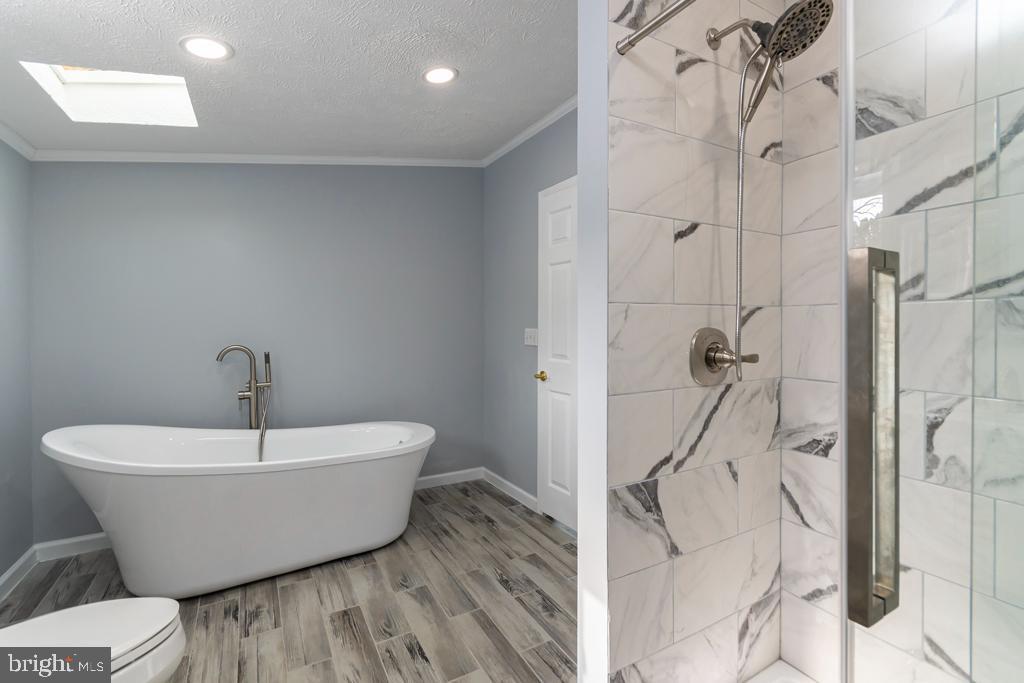 2202 Gregory Drive Forest Hill, MD 21050 - Photo 16 of 25 Luxurious soaking tub and vinyl plank flooring