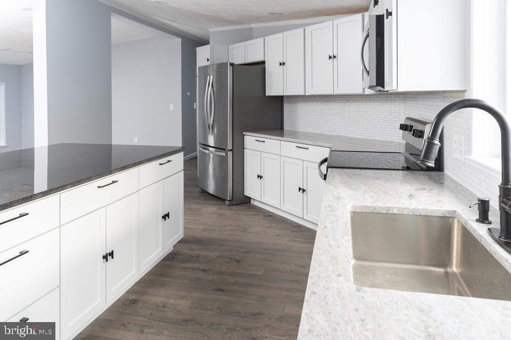 2202 Gregory Drive Forest Hill, MD 21050 - Photo 6 of 25 Quartz countertops and stainless steel appliances