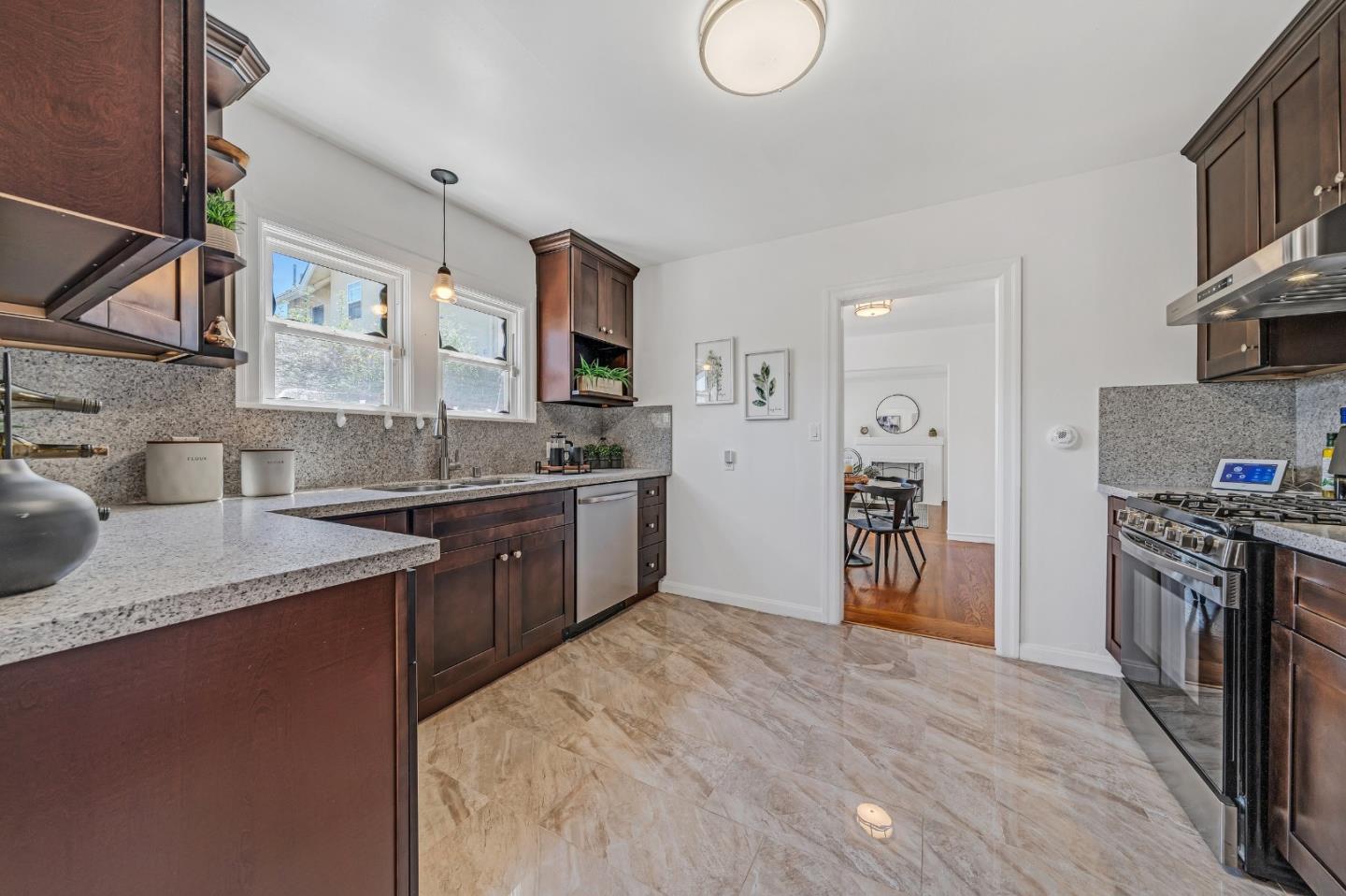 1490 Plaza Drive San Leandro, CA 94578 - Photo 13 of 39 a kitchen with stainless steel appliances granite countertop a sink stove and refrigerator
