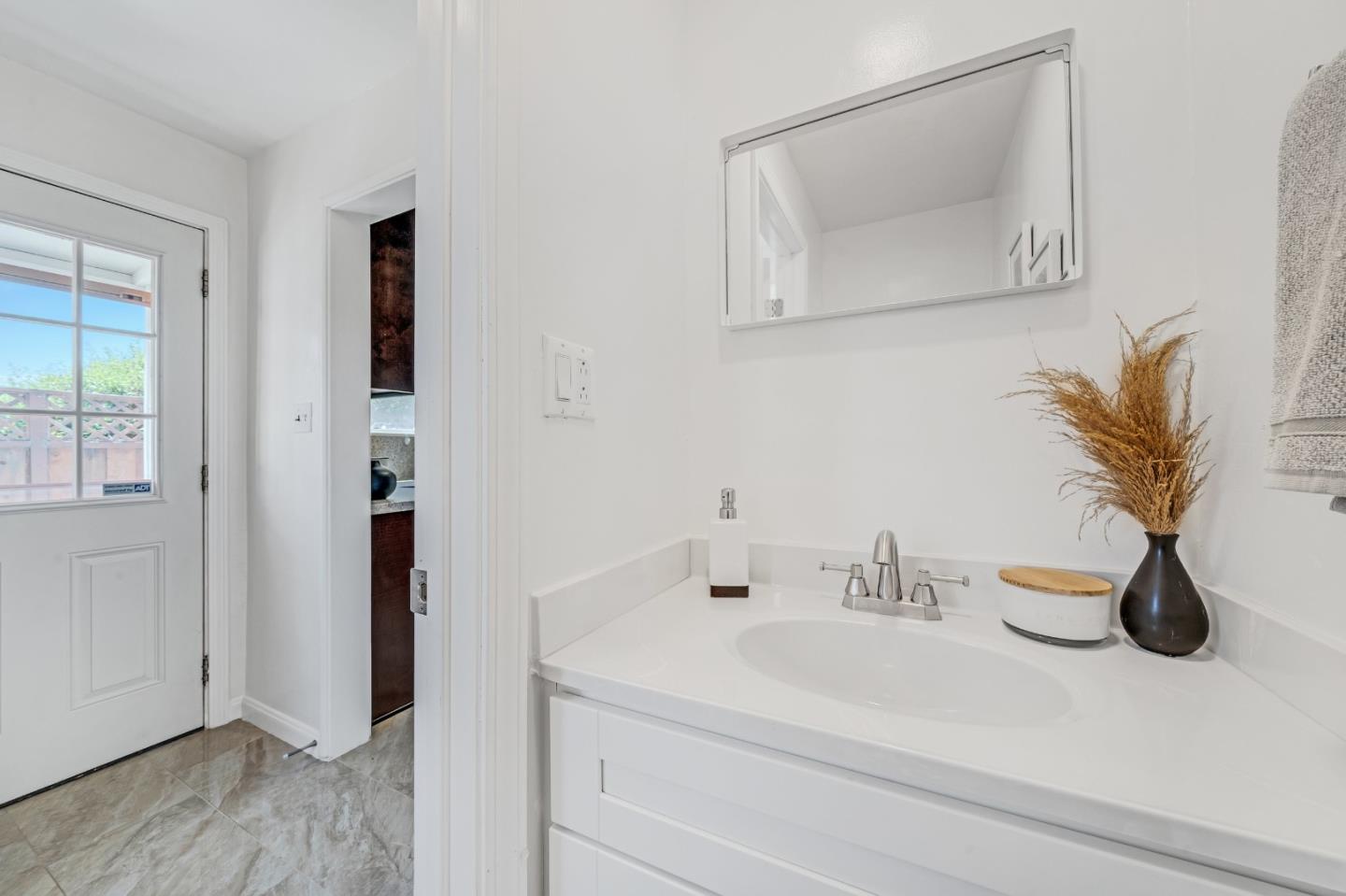 1490 Plaza Drive San Leandro, CA 94578 - Photo 15 of 39 a bathroom with a sink and a mirror