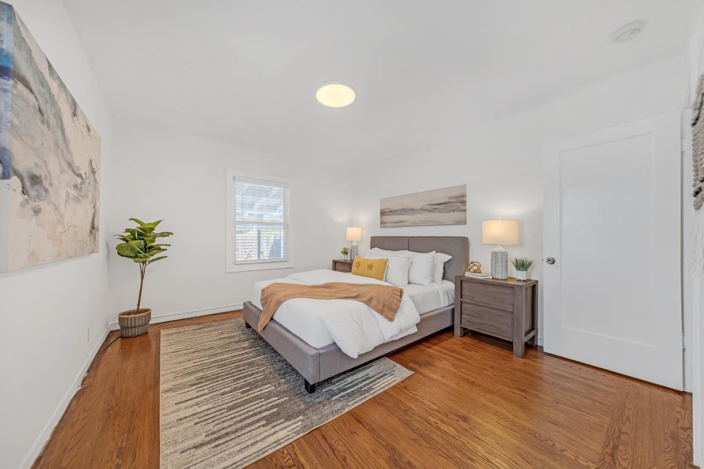 1490 Plaza Drive San Leandro, CA 94578 - Photo 18 of 39 a bedroom with a bed and a potted plant