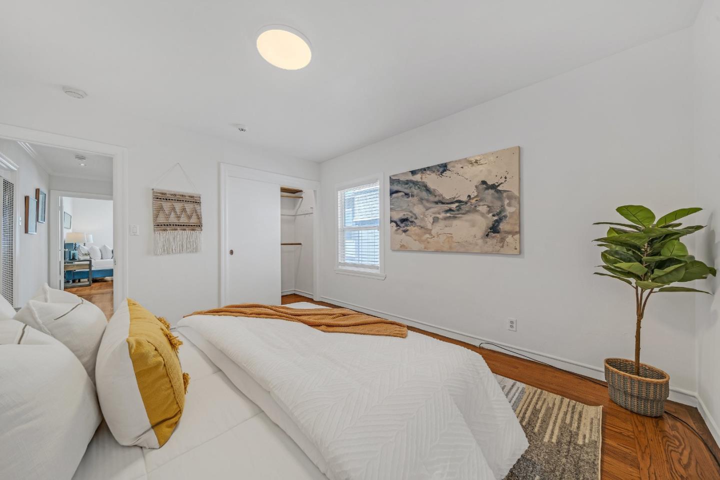 1490 Plaza Drive San Leandro, CA 94578 - Photo 19 of 39 a bedroom with a bed and a potted plant