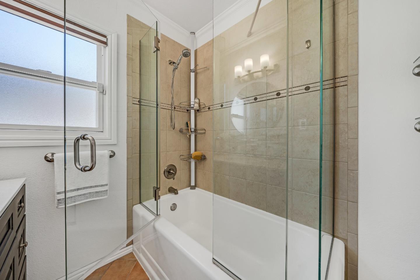1490 Plaza Drive San Leandro, CA 94578 - Photo 21 of 39 a bathroom with a shower a mirror and a bathtub